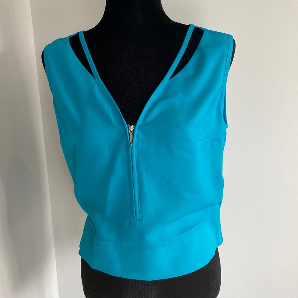 BEbe women’s size medium turquoise sleeveless blouse